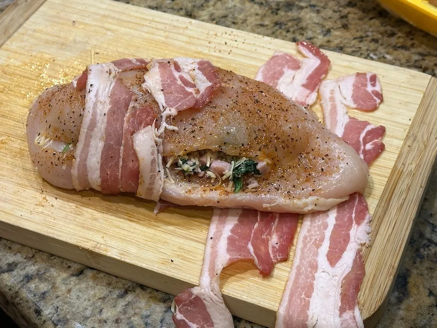 Stuffed chicken breast, seasoned and wrapped in bacon