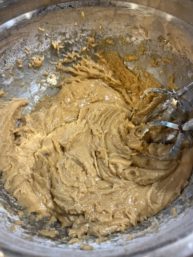 Brown butter, sugar, eggs, vanilla, flour and oats in the mixer
