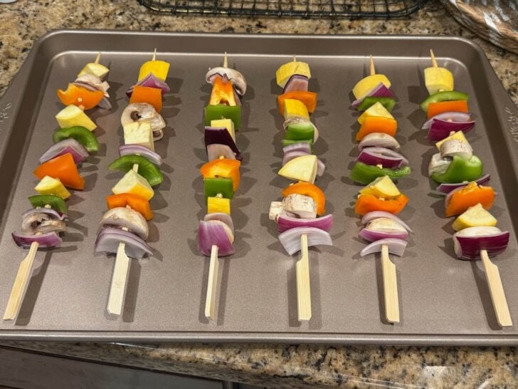 skewered veggies on baking sheet