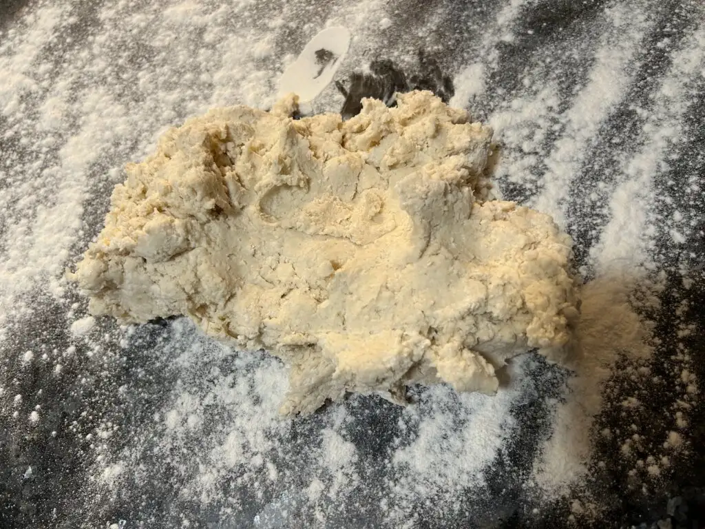 biscuit dough on floured surface