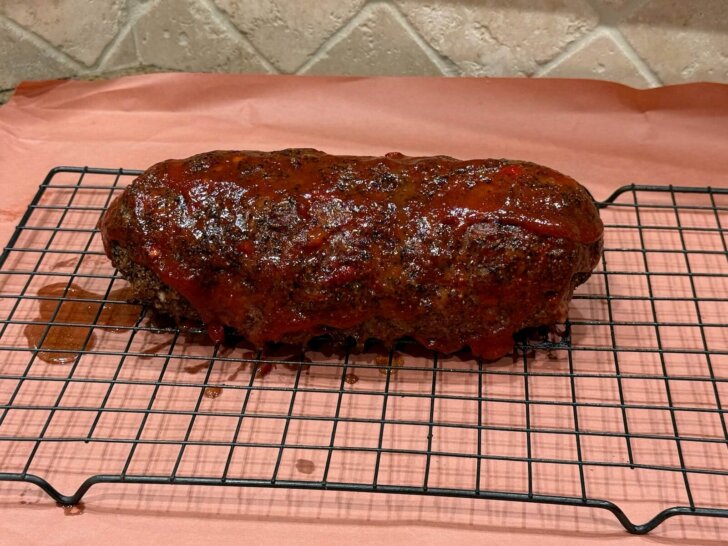 cooked meatloaf, resting on rack