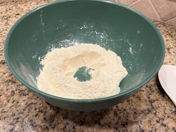 dry ingredients for cornbread with well in center