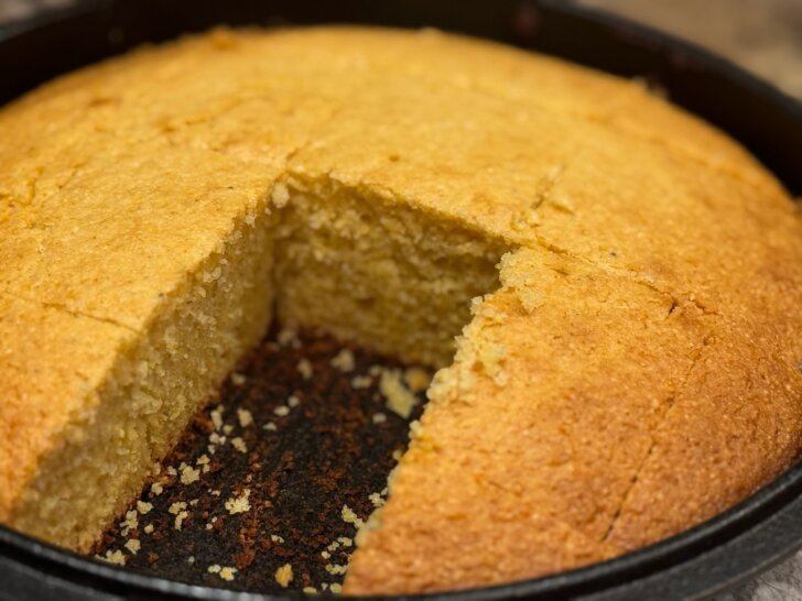 sliced cornbread in cast iron skillet