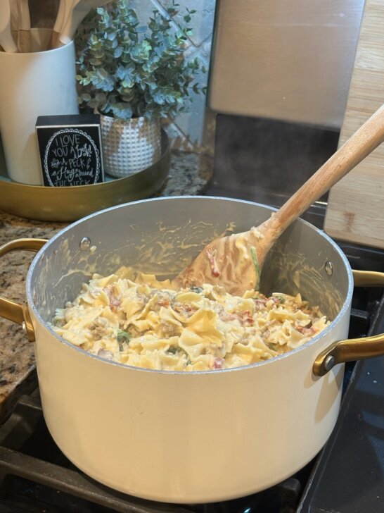 creamy italian bowtie pasta in pot on stove