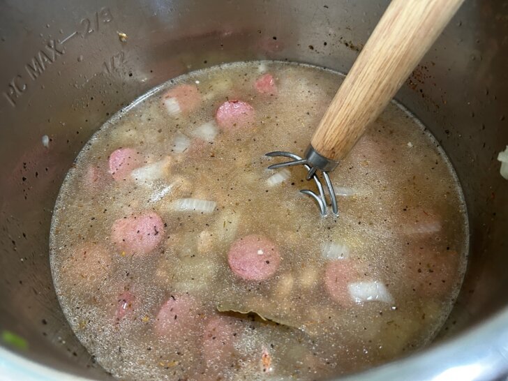 uncooked beans and broth added to the instant pot