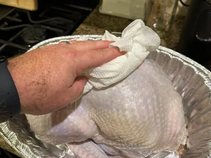prepping a turkey for grilling