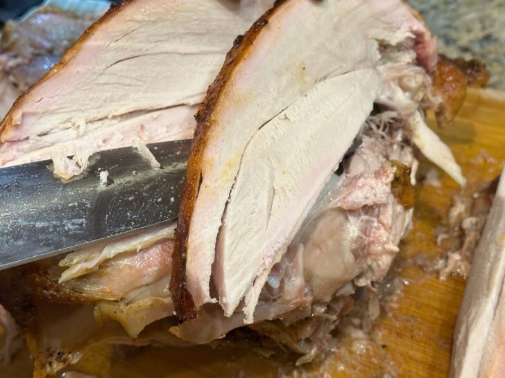 juicy sliced turkey on cutting board