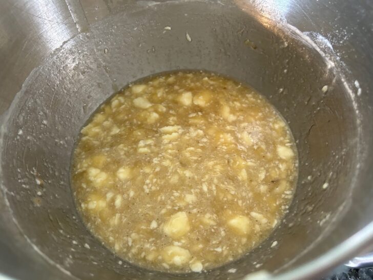 banana bread, wet ingredients mixed in bow