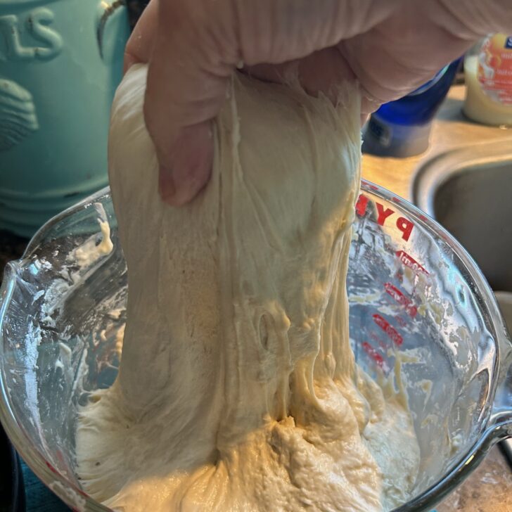 Same Day Jalapeno Cheddar Sourdough Rolls (dough in bowl during stretch and fold phase)