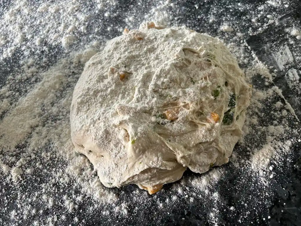 Same Day Jalapeno Cheddar Sourdough Rolls (dough with flour sprinkled on top)