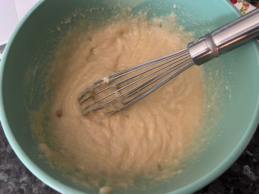 texas sheet cake ingredients mixed in bowl