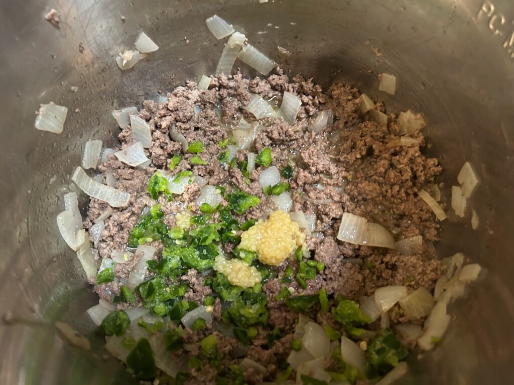 ground beef and onions with garlic and jalapeno added
