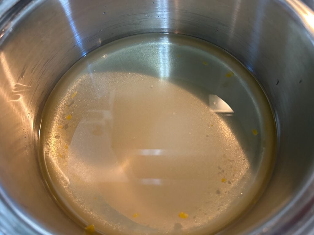 water and sugar syrup in pan on stove