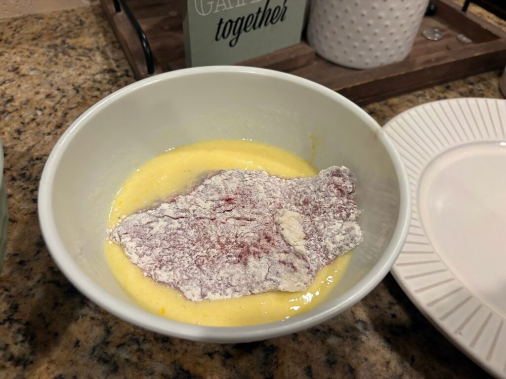 beef cutlet in egg mixture