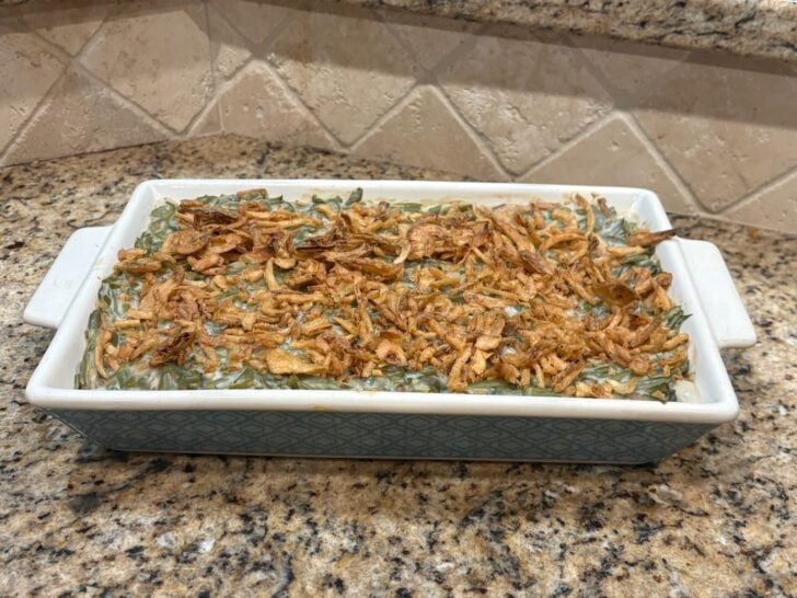 green bean casserole, baked and ready to eat in casserole dish