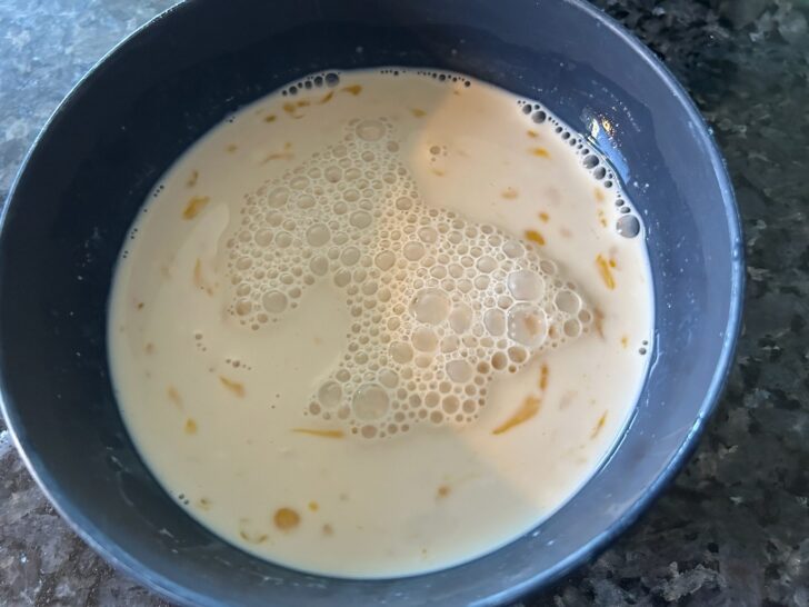 wet ingredients for cornbread in bowl