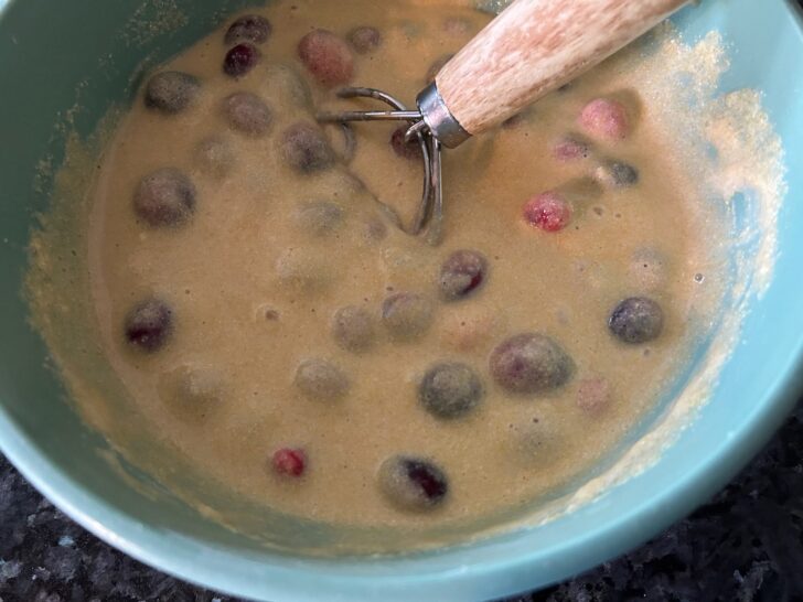 cornbread batter with cranberries mixed in