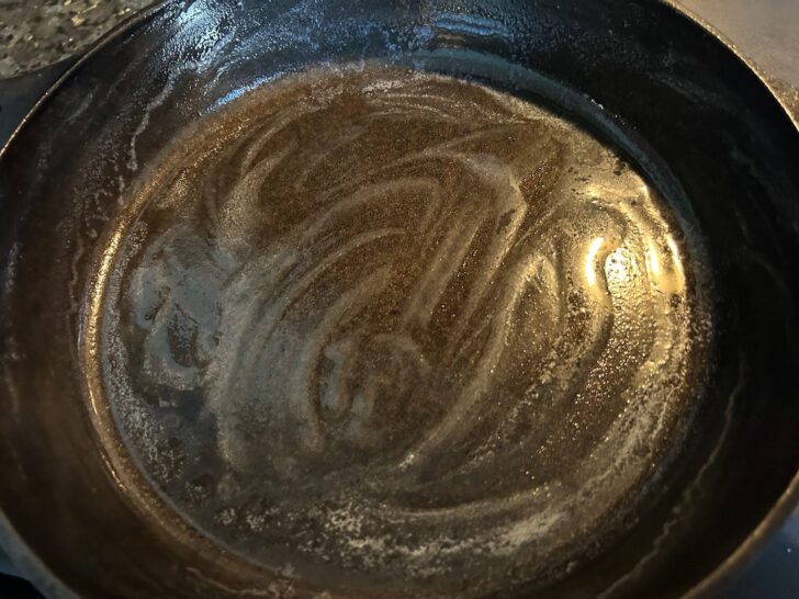 hot cast iron skillet with butter