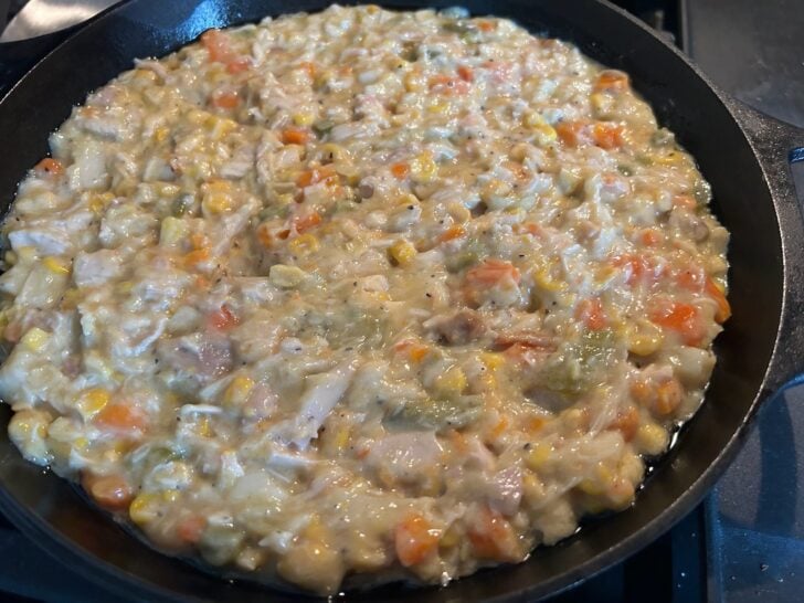 turkey pot pie mixture in cast iron skillet