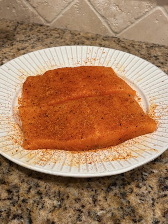 raw seasoned salmon on plate