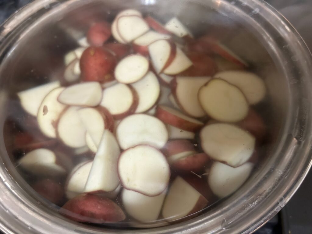 sliced potatoes in water