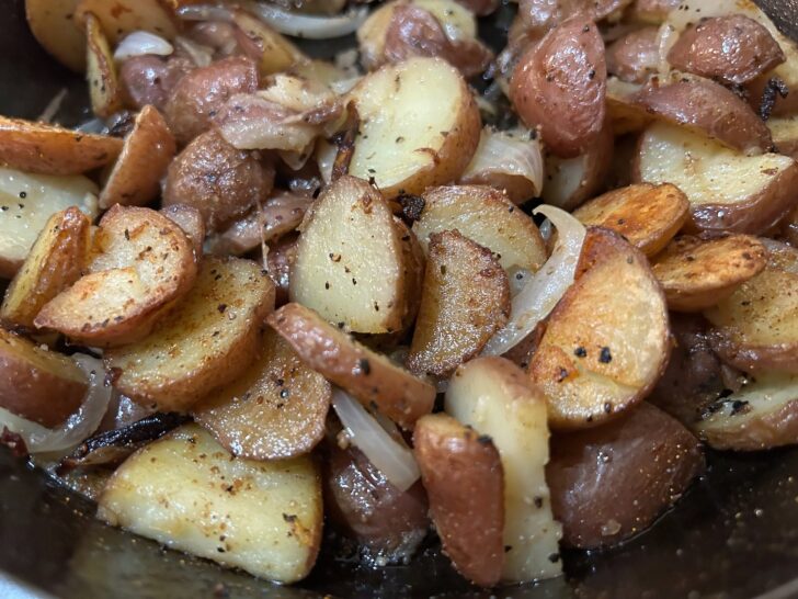 Skillet potatoes and onions on the grill