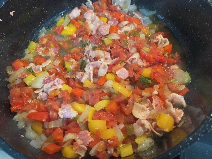 vegetable sauteeing in skillet with bacon