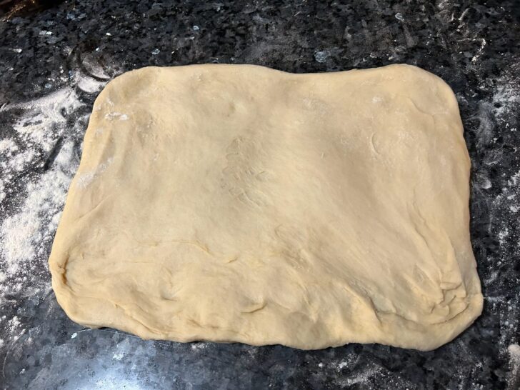 bread dough spread into rectangle
