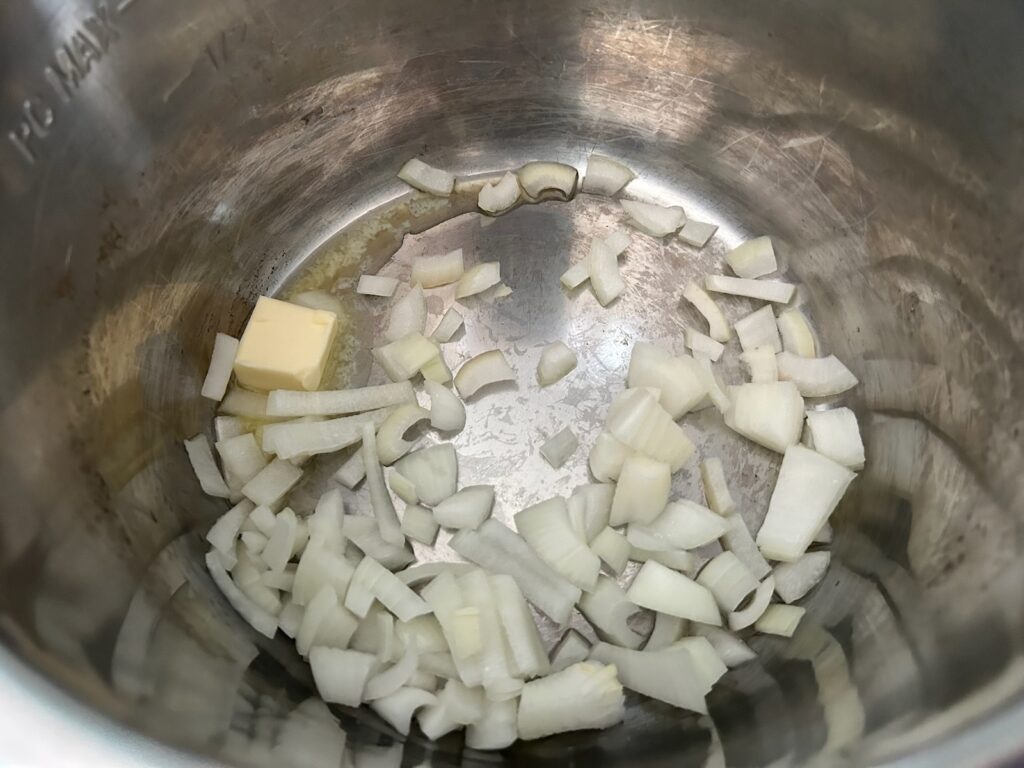 onions and butter in the bottom of instant pot