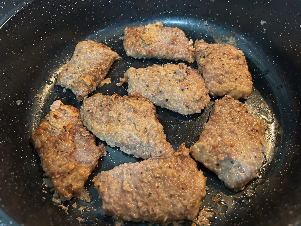 beef steaks in pan