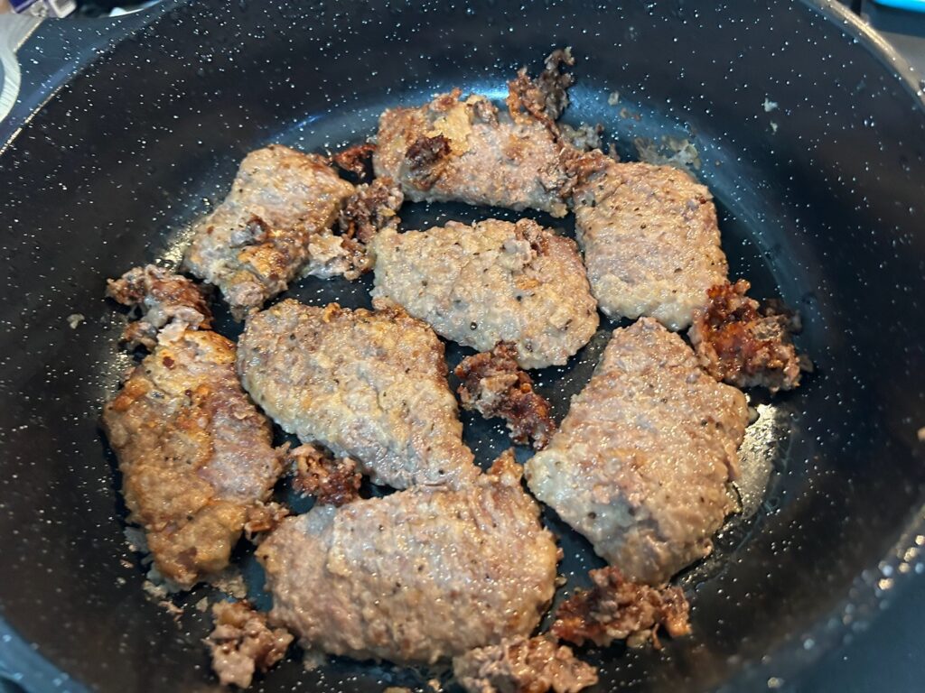 beef steaks in pan