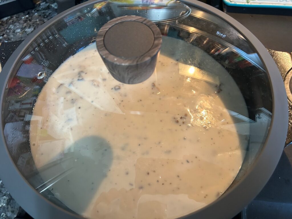 beef steaks in pan smothered in gravy