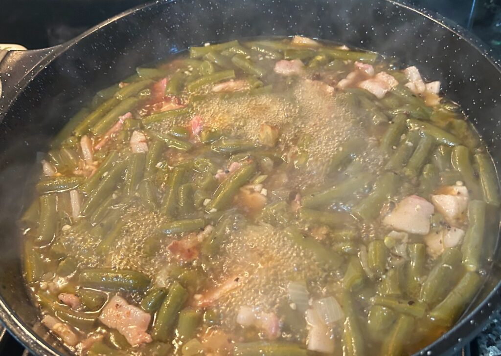 green beans simmering in pot on stove