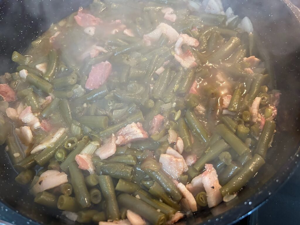green beans simmering in pot on stove