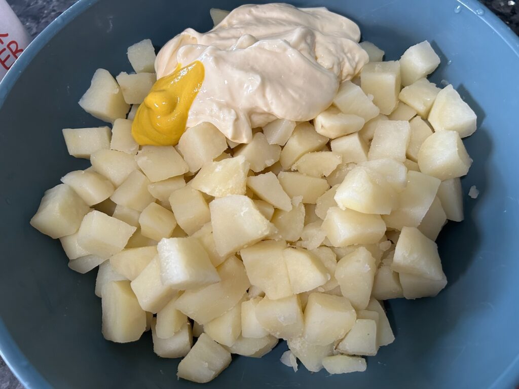 cubed boiled potatoes with mayonnaise and mustard