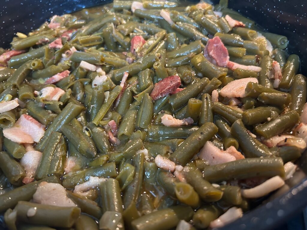 green beans simmering in pot on stove