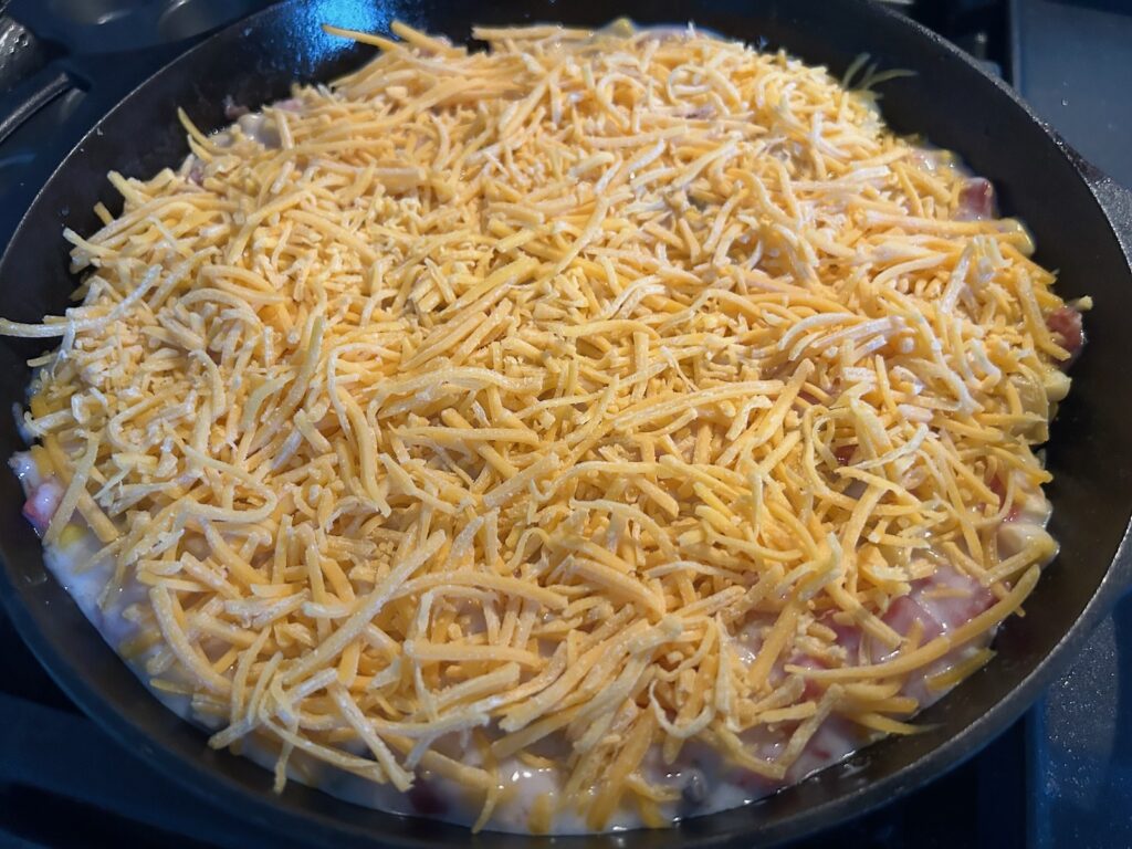 mushroom soup with rotel and cheese in skillet