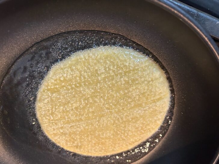 corn tortilla in skillet