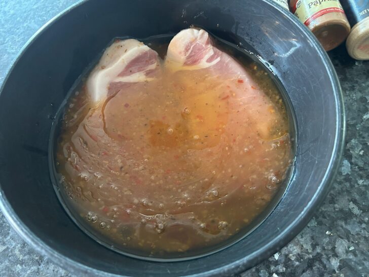 pork chops marinating in italian dressing
