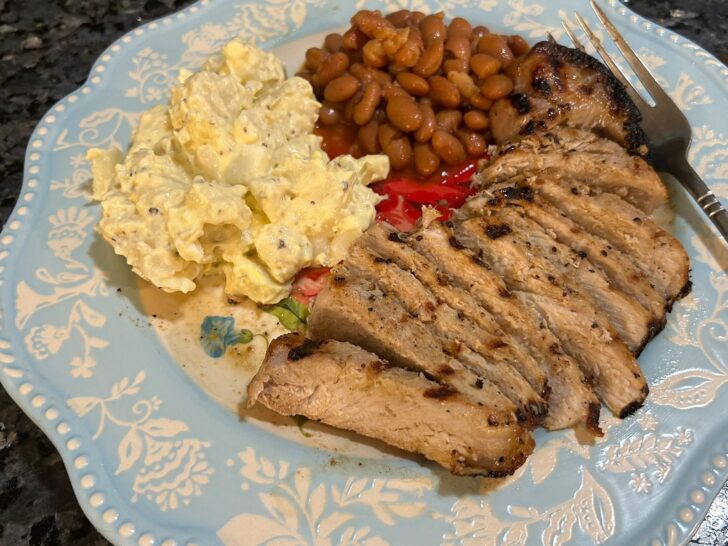 How to Grill Thick-Cut Pork Chops (sliced pork chop with potato salad and beans)