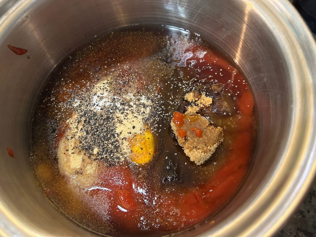 Foolproof Texas BBQ Sauce ingredients in pan on stove