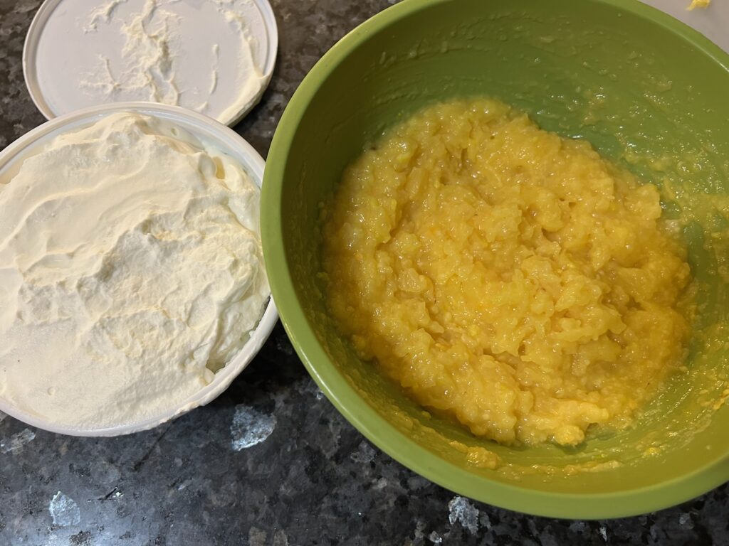 pineapple mixture with whipped cream nearby