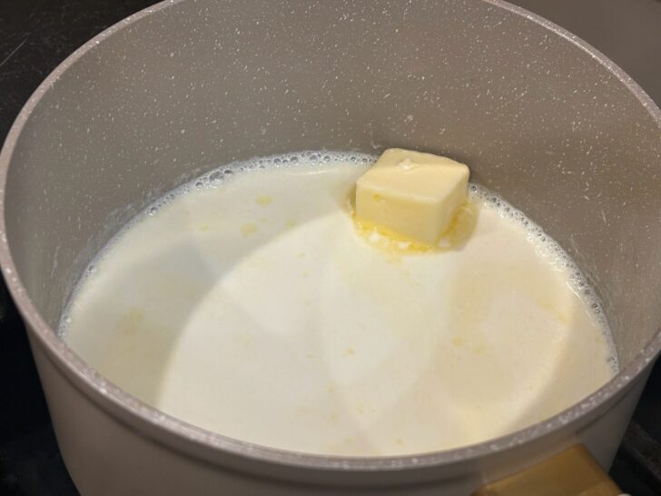 Easy Homemade Alfredo Sauce simmering on stove