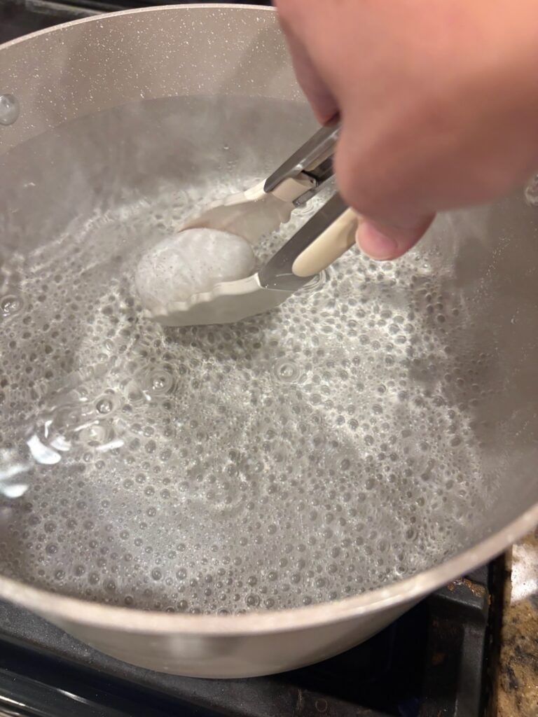 egg in pan of water