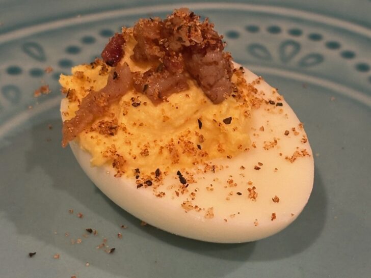 beautiful deviled egg with bacon crumbles