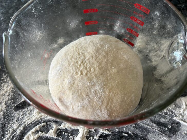 ball of bread dough in bowl