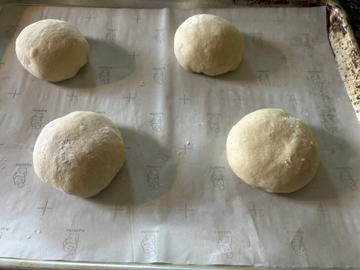 dough balls on parchment lined tray