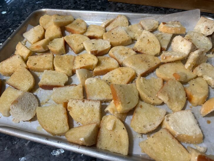 sliced bread dipped in butter and seasonings