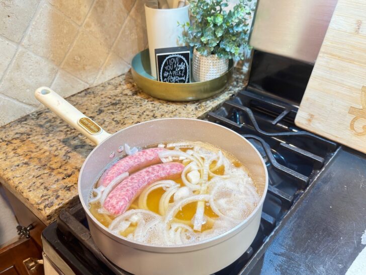 Texas Beer Brats simmering on stove