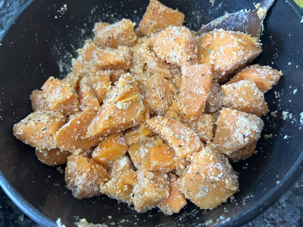 canned sweet potatoes with seasonings in bowl